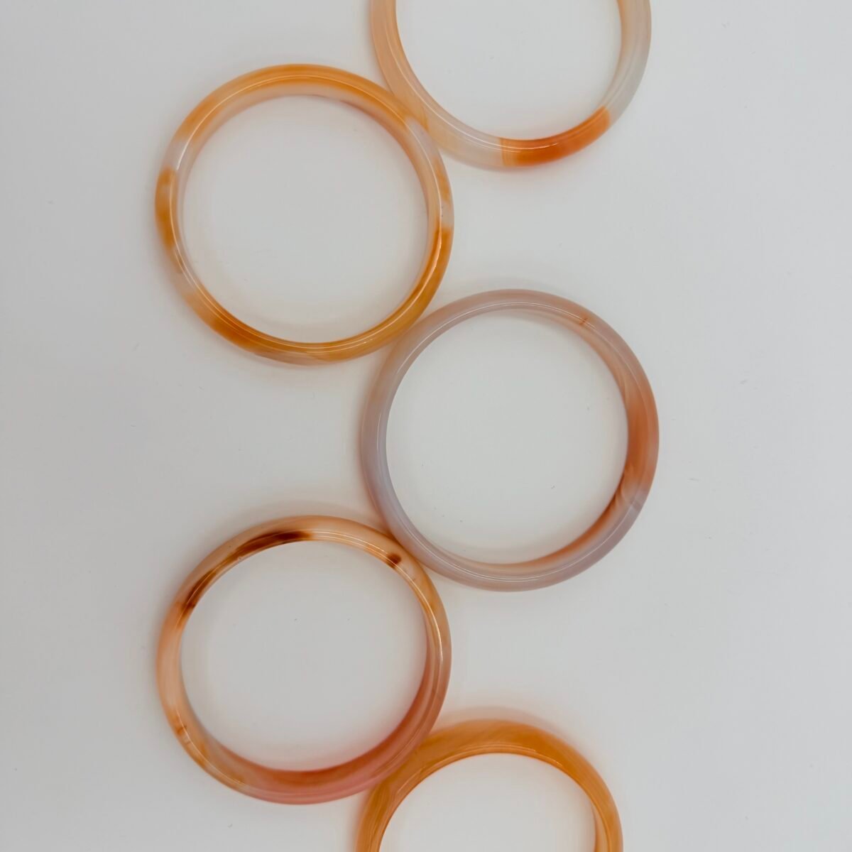 Elegant Khorasan Gems bangles in warm amber tones.