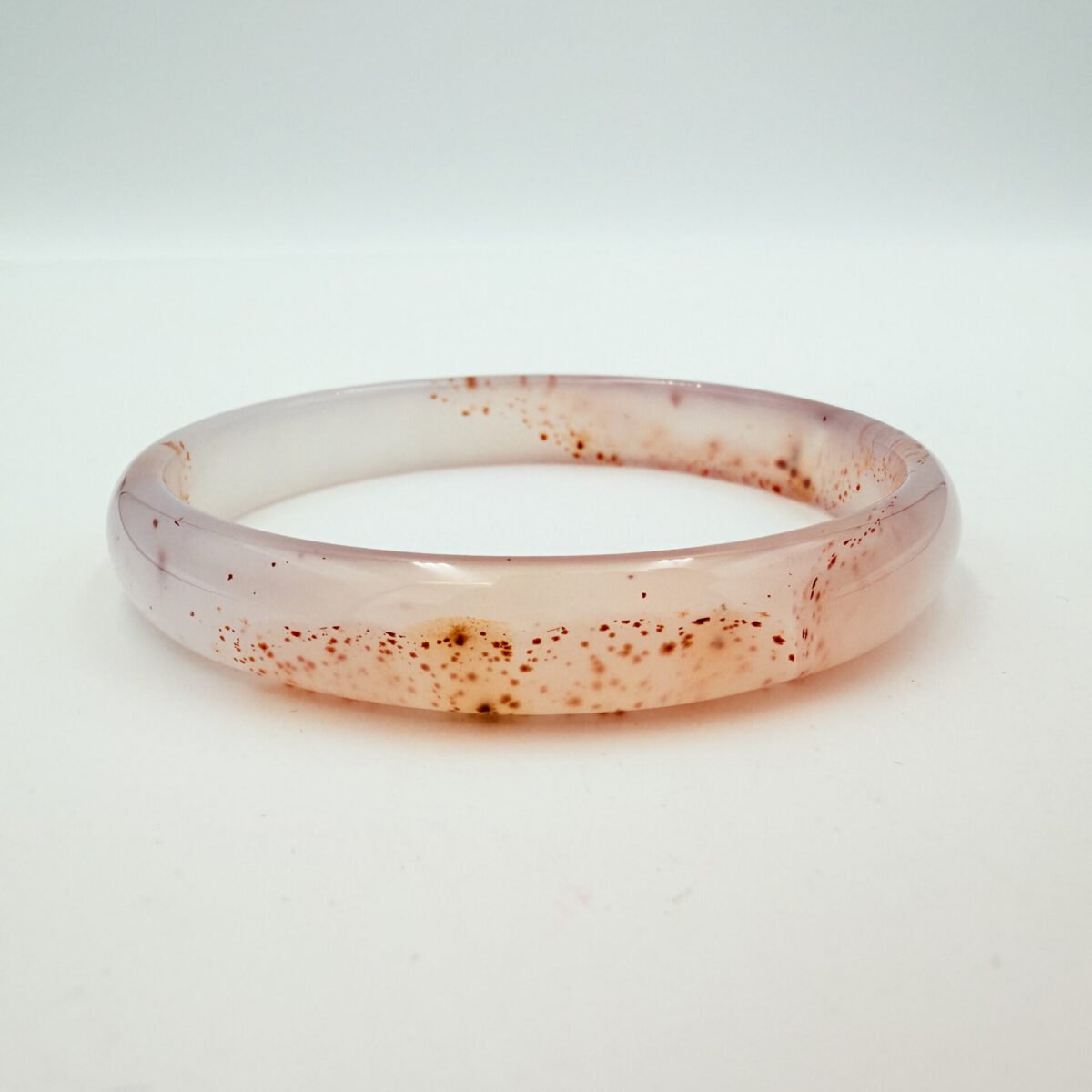Red-Speckled Translucent White Agate Bangle