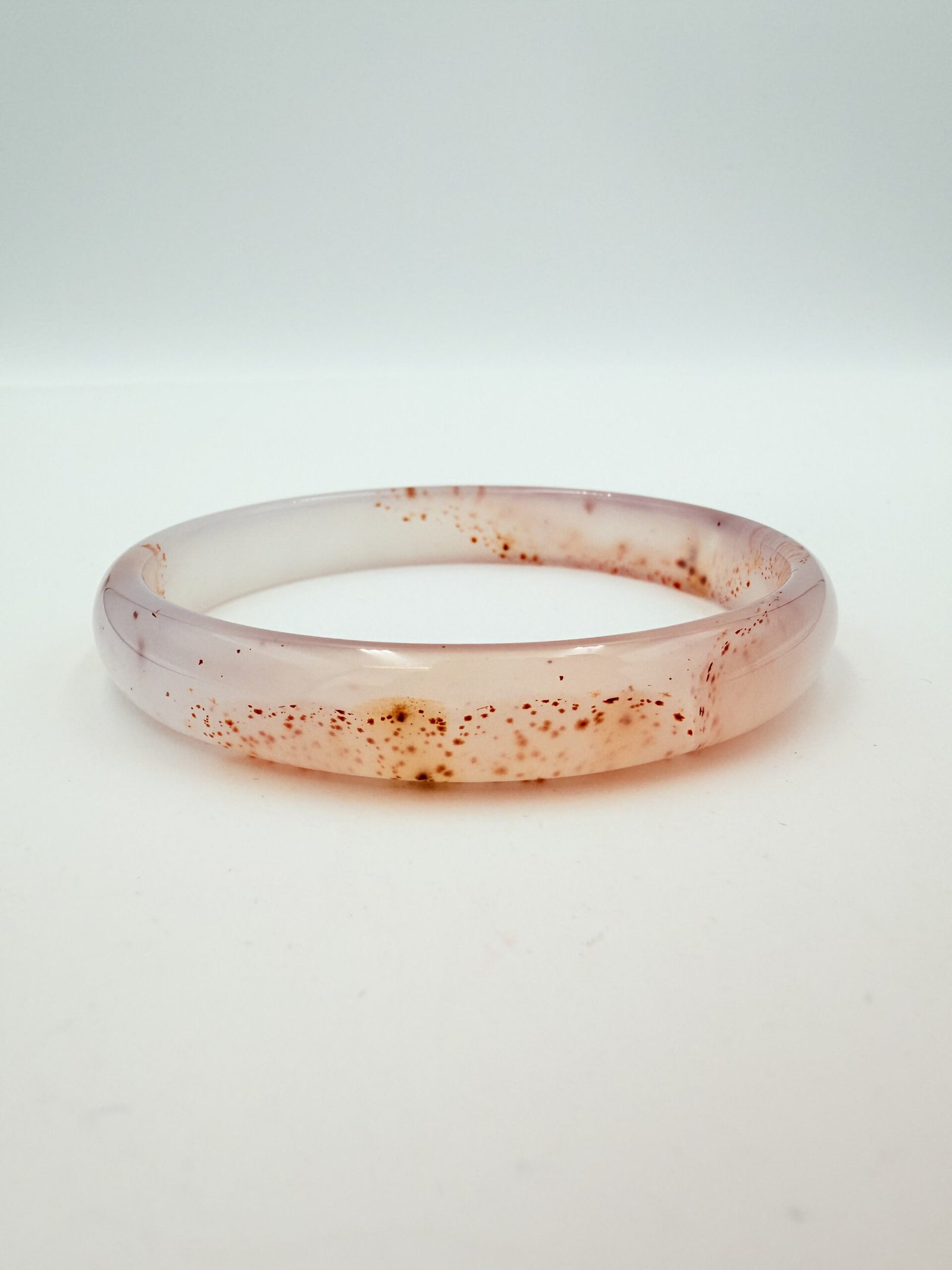 Red-Speckled Translucent White Agate Bangle